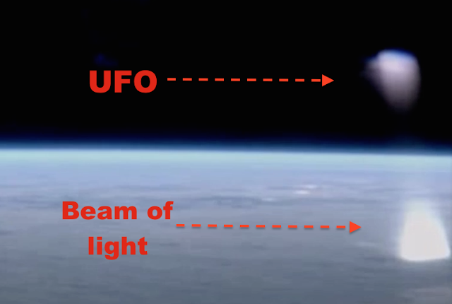 ufo εκπέμπει φως και σαρώνει τη γη