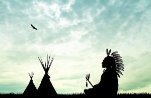 Αρχαίοι Έλληνες στην Αμερική σε Φυλές Ινδιάνων καθιστός ινδιάνος μπροστά σε ινδιάνικες σκηνές - πριν φτάσουν αρχαίοι Έλληνες στην Αμερική